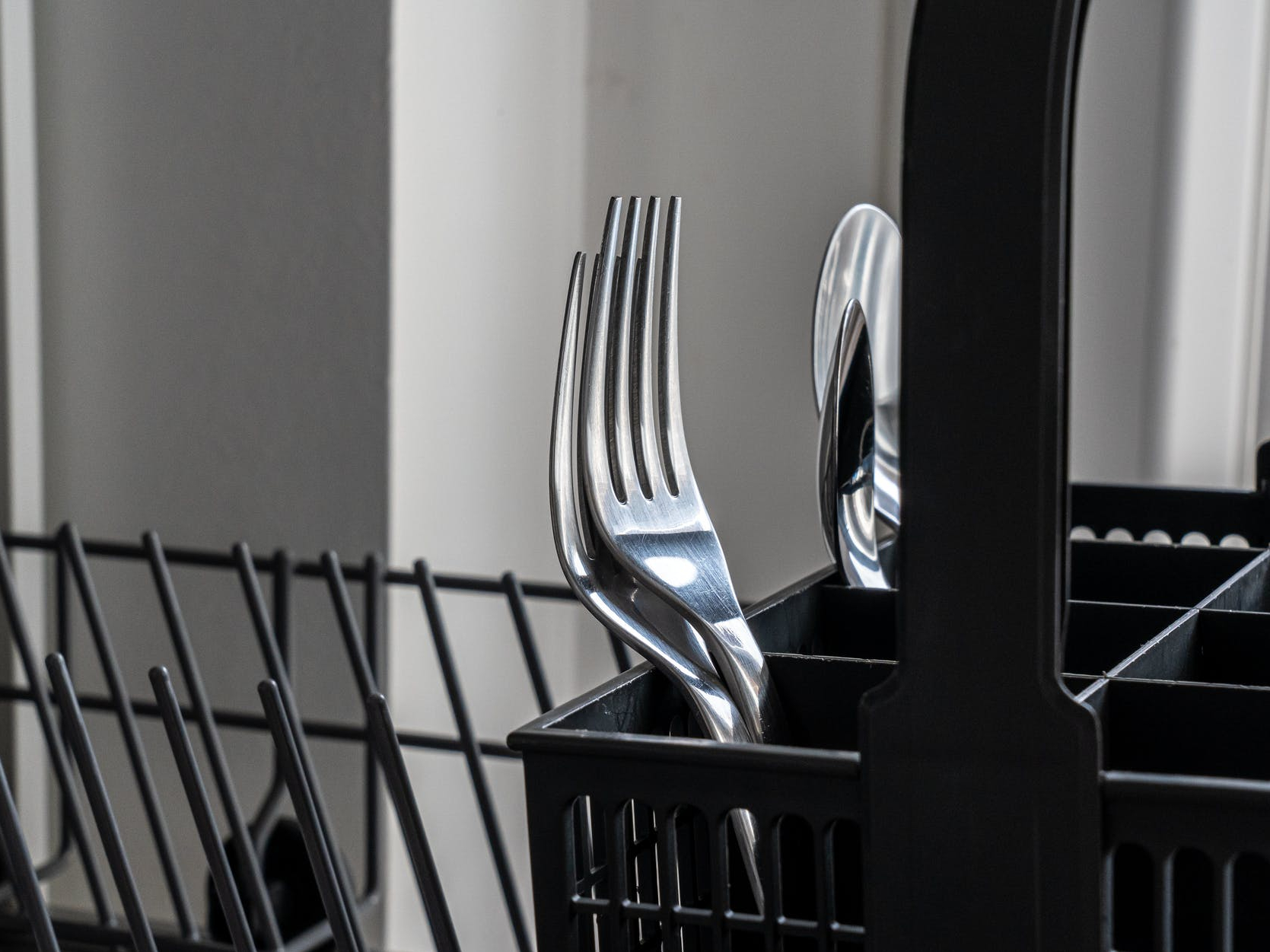 When loading the dishwasher, do you put forks in facing up or down?