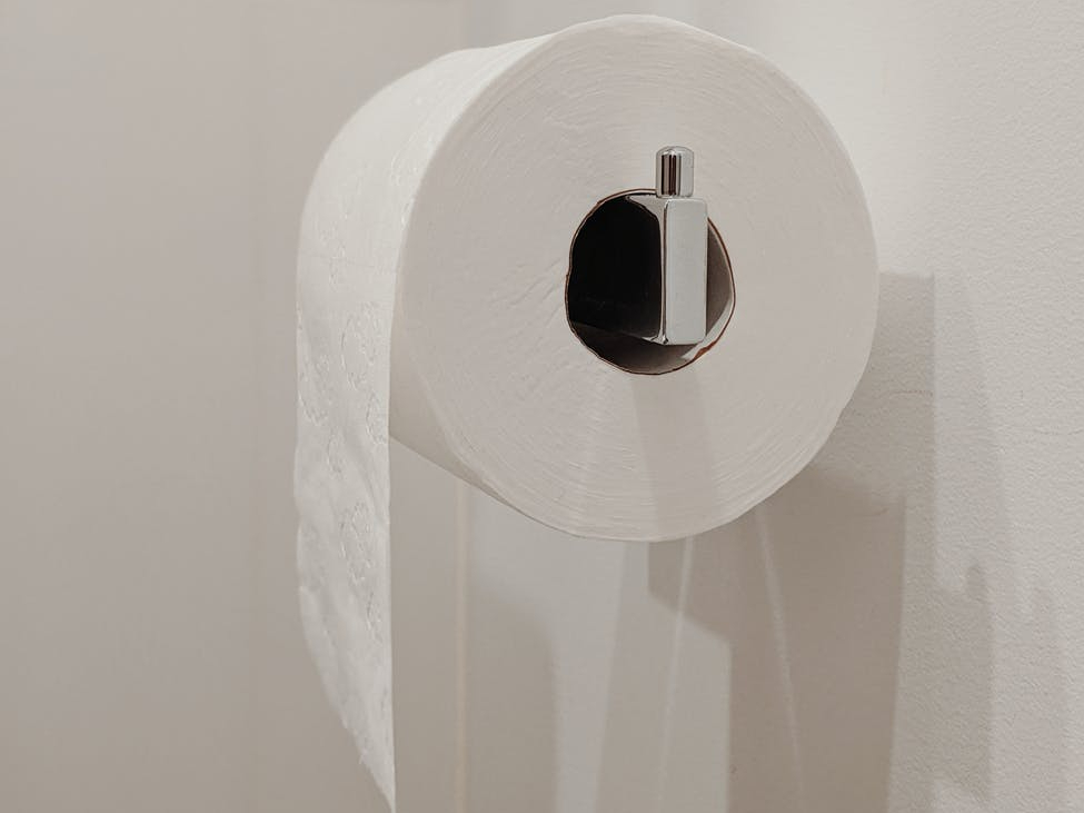 Do you dispense the toilet paper roll from the front/top or back/bottom?